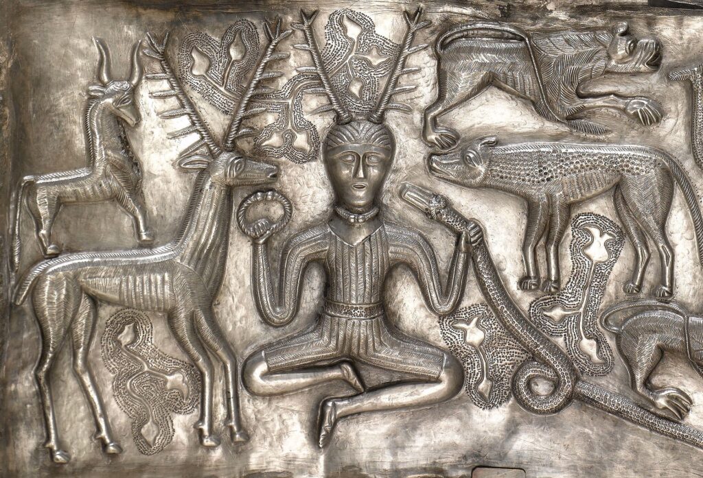 Detail of the antlered figure holding a torc and a ram-headed snake depicted on the 1st or 2nd century BC Gundestrup cauldron